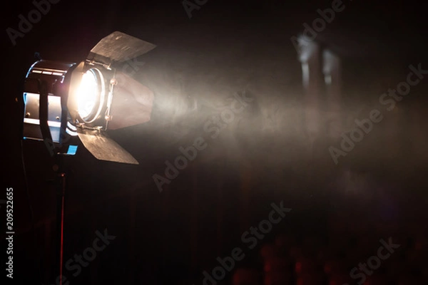 Obraz Studio spotlight using for background production film . silhouette blurred led lights with smoke in dark room . electric tools set for photography , video maker , cinematography