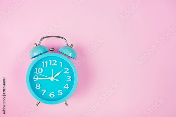 Obraz Alarm clock on pink background.