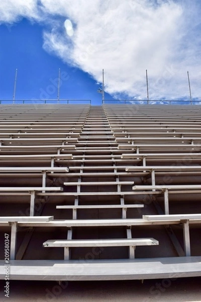 Obraz Stadium Bleachers with Blue Sky and Clouds