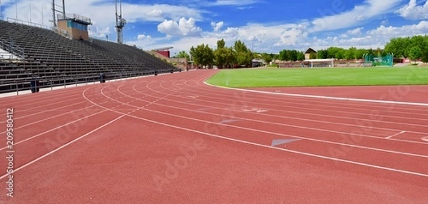Fototapeta Red track at stadium