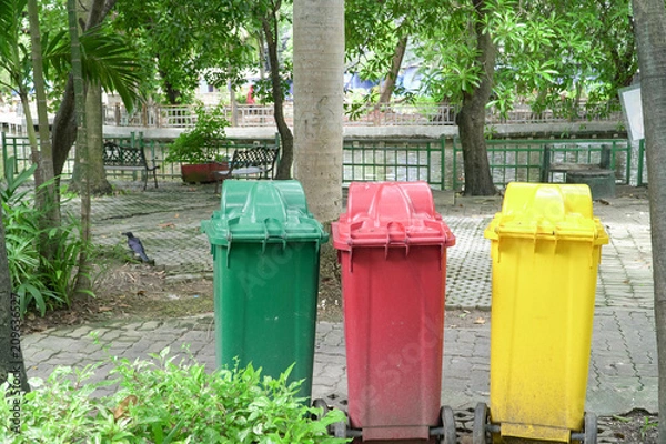 Fototapeta Colorful Three Recycle Bins In The Park, Environmental protection