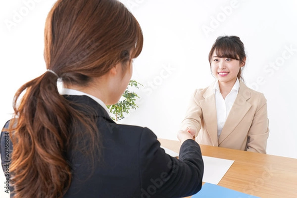 Fototapeta 握手をするビジネスパーソン