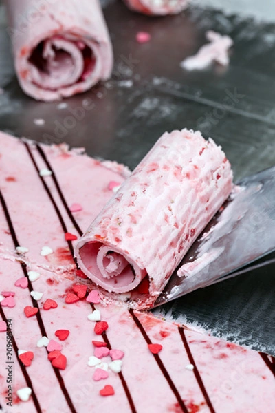 Obraz Thai roll ice cream is made by hand on the freezer. Sweet dessert made from natural berries and ingredients. The process of making food.