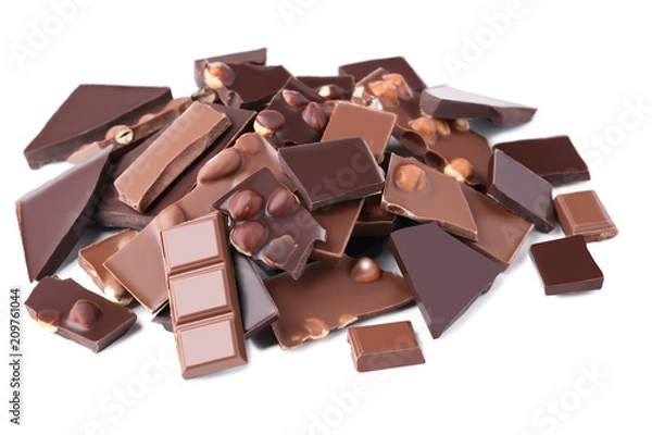 Fototapeta Chocolate pieces with hazelnuts isolated on white background