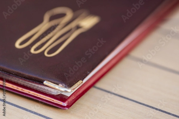 Fototapeta menu letter of a restaurant on a table with lines