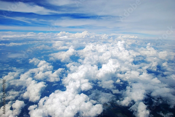 Fototapeta Aerial view of peaceful earth covered in clouds