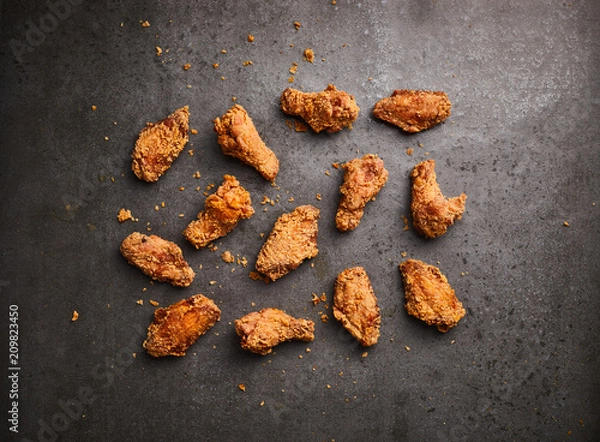 Obraz fried chicken on a dark background, top view
