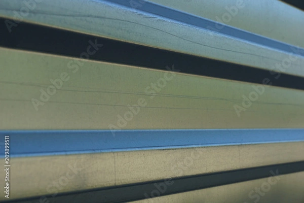 Fototapeta metal profile texture background. metal fence in the construction of the building