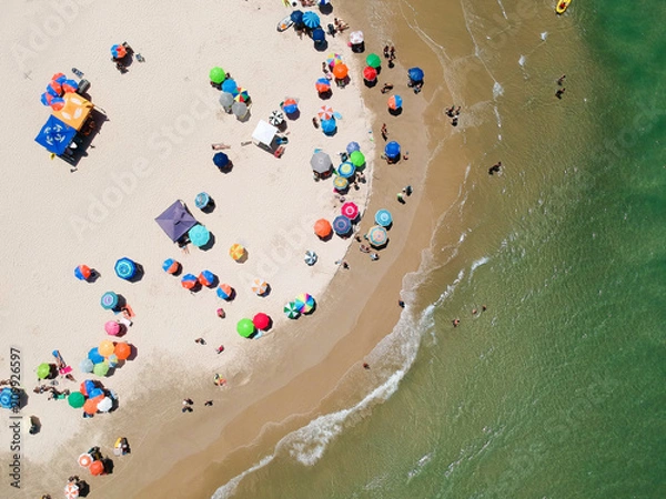 Fototapeta Aerial view of colorful umbrella on the beach