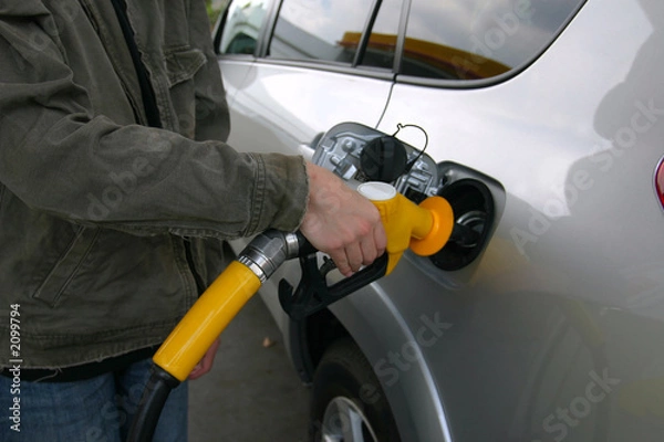 Fototapeta filling up with fuel