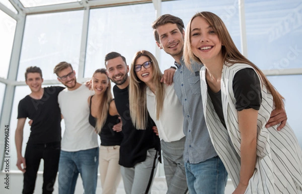Obraz group of successful young people standing in the office