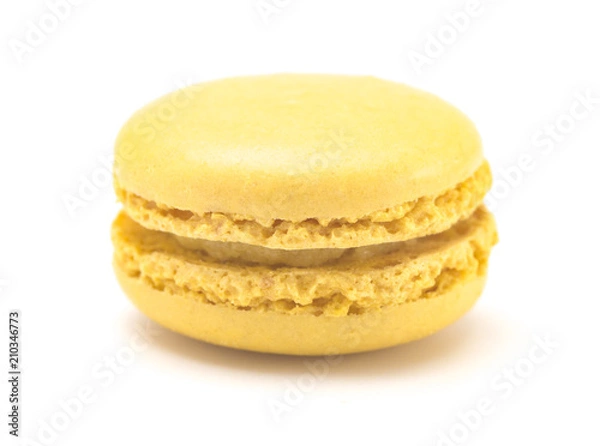 Obraz Single Yellow French Macarons on a White Background