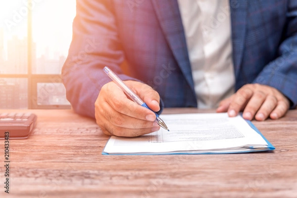 Obraz Businessman signing contract