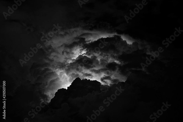 Fototapeta The strongest thunderstorm over the mountains of the Caucasus in the night sky. Flash of lightning above the head in the clouds. Thunderous thunder.