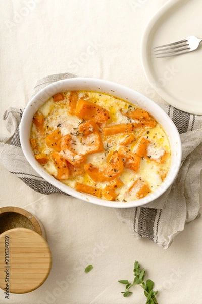 Obraz Roasted squash baked with heavy cream, thyme, white wine and parmesan cheese