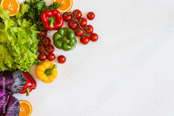 Fototapeta Fresh colorful organic vegetables on a white background, farming and healthy food concept. Copy space. Flat lay
