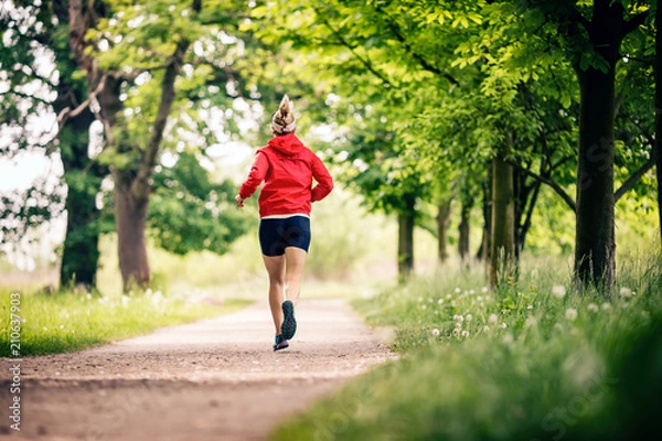 Obraz Running woman, enjoying summer day in park