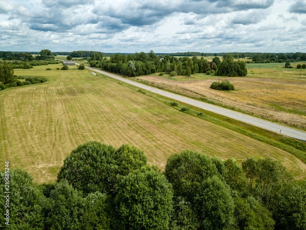 Fototapeta drone image. aerial view of rural area with fields and road network
