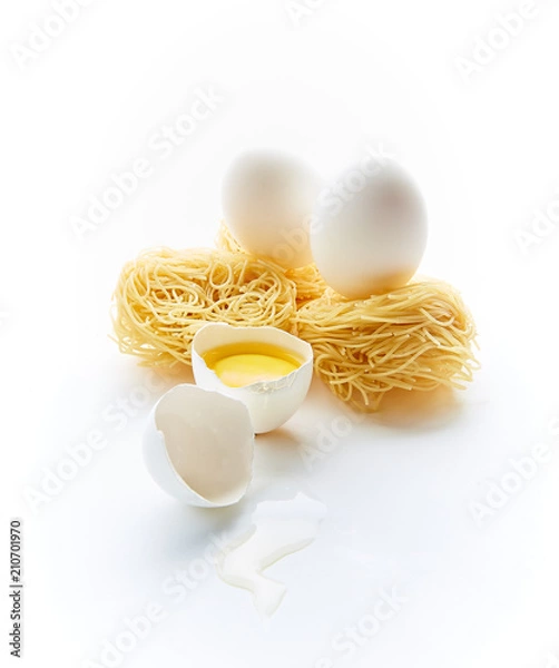 Fototapeta egg pasta and chicken eggs with yolk on a white background