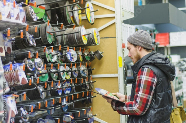 Fototapeta Man in a hardware store