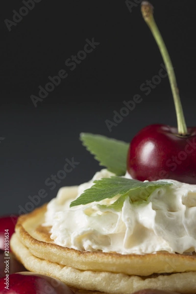 Fototapeta Pancakes with cherries and whipped cream