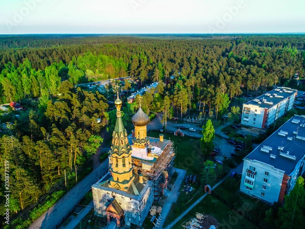 Fototapeta temple in the middle of the forest in the Leningrad region, Russia photo from a height