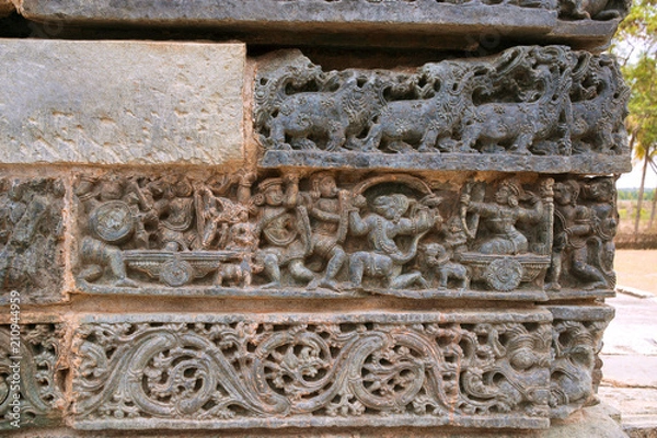 Fototapeta Friezes at the base of temple. Kedareshwara temple, Halebidu, Karnataka, India
