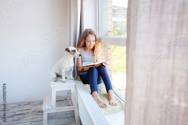 Fototapeta Girl reading book at home