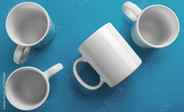 Obraz White mug side and top view on blue background