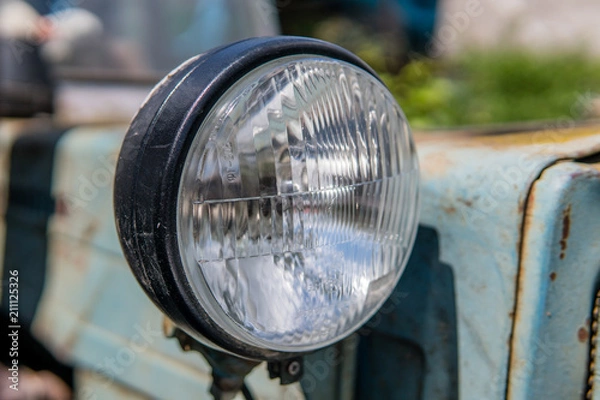 Fototapeta front circle of the tractor headlight