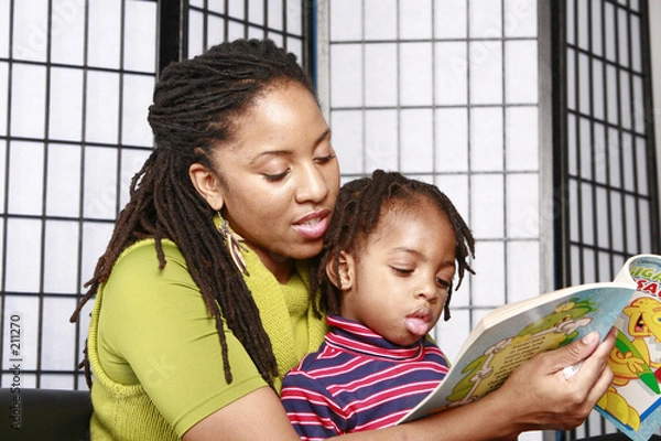 Fototapeta mother and son reading together