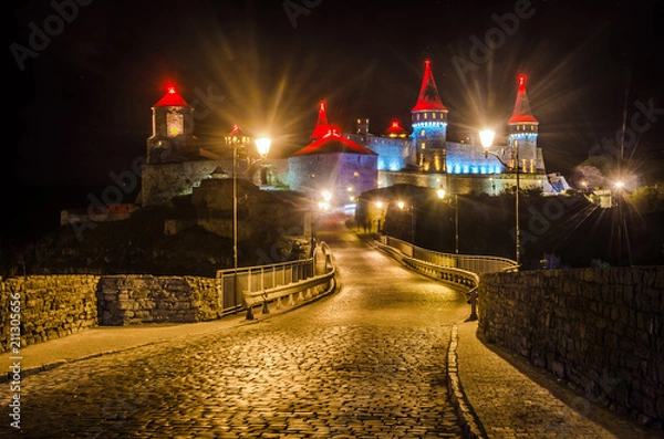 Obraz Fortress in Kamenets-Podolsky with evening lights