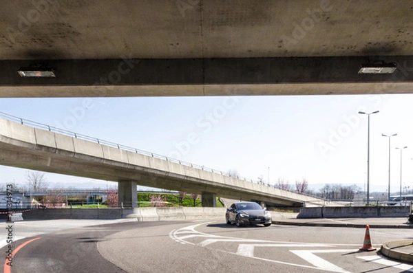 Obraz Modern electric car in urban concrete landscape