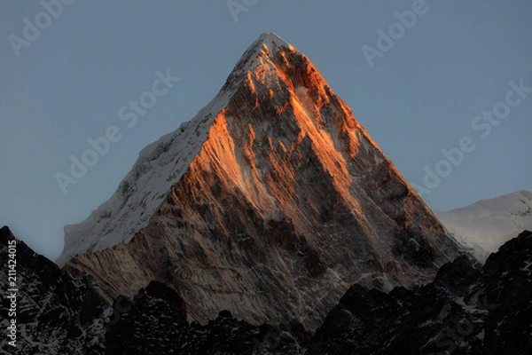 Fototapeta Snow Mountain Glowing Red during Sunset. Golden Mountain, Jinshan, Sichuan Province China
