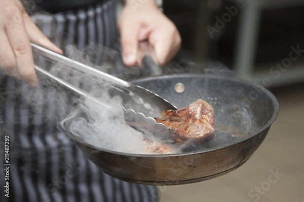 Obraz Hands chef cooking lamb