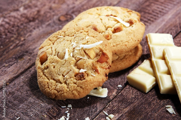 Fototapeta stack of macadamia nut and white chocolate cookies on table with chocolate chip