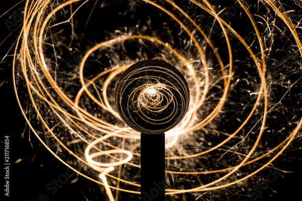 Fototapeta magic crystal ball with sparkles sparklers electricity spinning in circles
