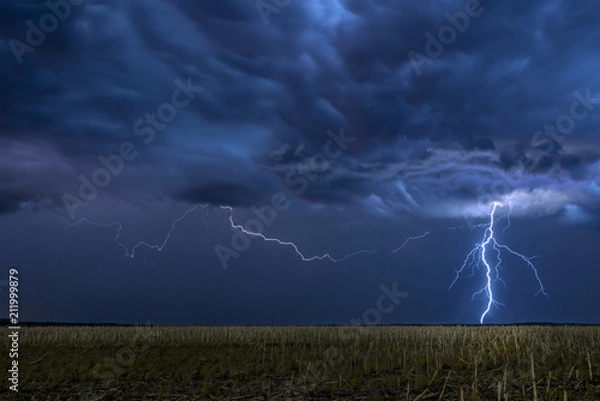 Fototapeta Lightning storm over field in Oklahoma