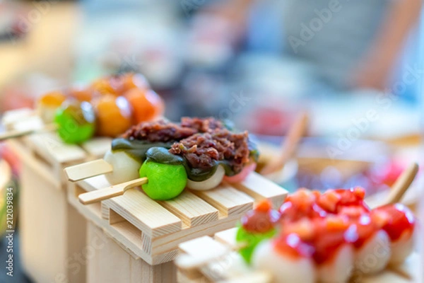 Obraz Mitarashi dango. Dango Japanese dessert, dumpling and sweet made from rice flour, covered with a sweet soy sauce glaze. This dango is also sold in supermarkets and convenience stores in Japan.