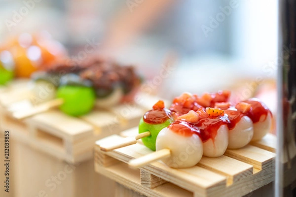 Obraz Mitarashi dango. Dango Japanese dessert, dumpling and sweet made from rice flour, covered with a sweet soy sauce glaze. This dango is also sold in supermarkets and convenience stores in Japan.
