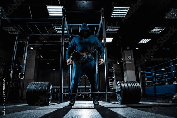 Obraz Strong man working in gym