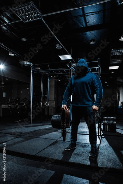 Obraz Strong man working in gym