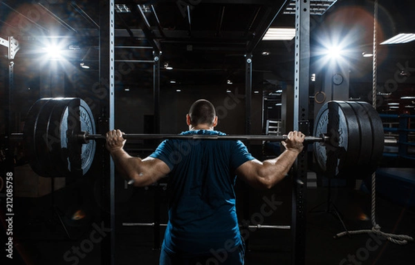 Obraz Strong man working in gym