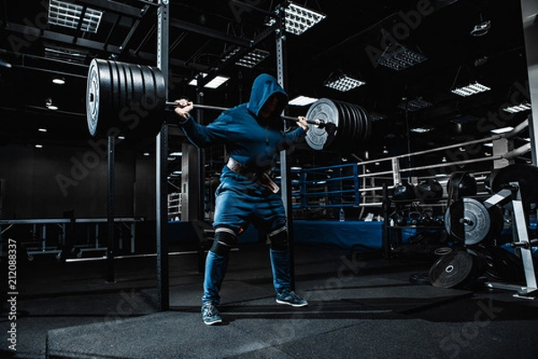 Obraz Strong man working in gym