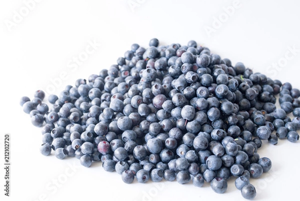 Fototapeta Blueberries on a white background close up, soft focus. Summer wild berry