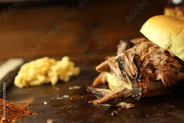 Fototapeta Pulled Pork Sandwich on Rustic Cutting Board
