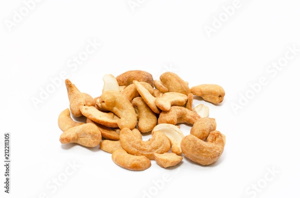 Obraz Salt roasted cashew nuts isolated on white background.