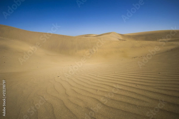 Fototapeta minimalistic view of sand dunes landscape, minimalism in nature, sand everywhere and windy weather, shapes and creations