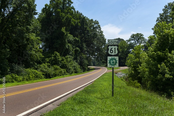 Fototapeta A Great River Road Sign along the US Route 61 near the city of Vicksburg, in the State of Mississippi; Concept for travel in America and road trip in America.