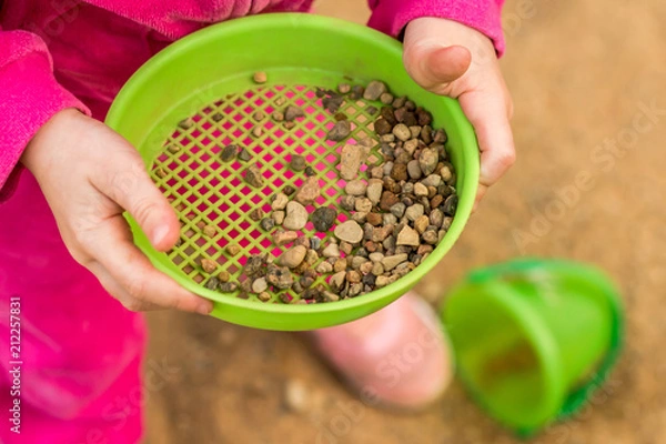 Obraz The child is playing in the sandbox. Children's hands.